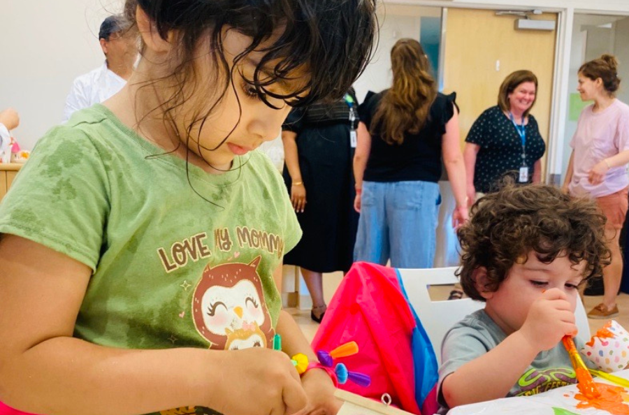 Two children doing arts and crafts.