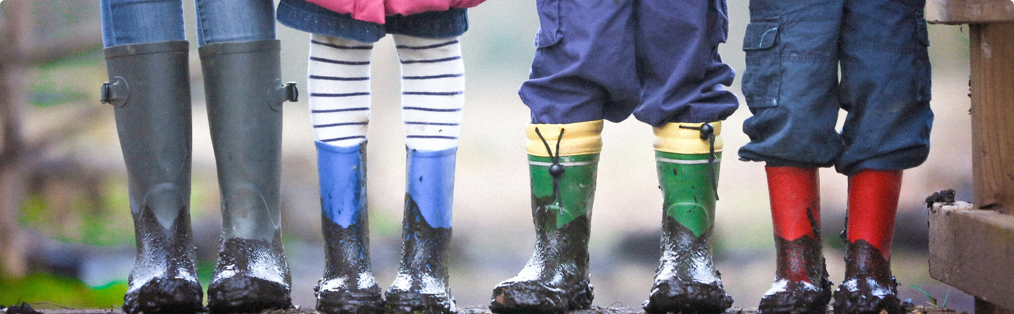 A child smiles at the camera. Overlay text reads: "Autism ABA Services. Serving children with autism and their families with quality, evidence-based therapies and expert staff."