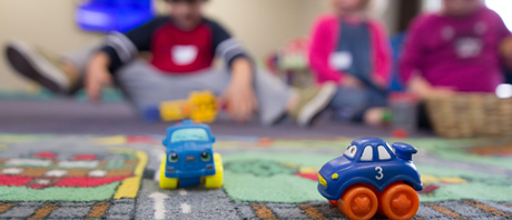 Children playing with toy vehicles