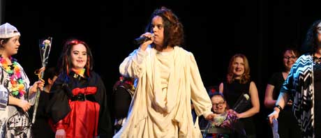 Teenagers putting on a play on stage