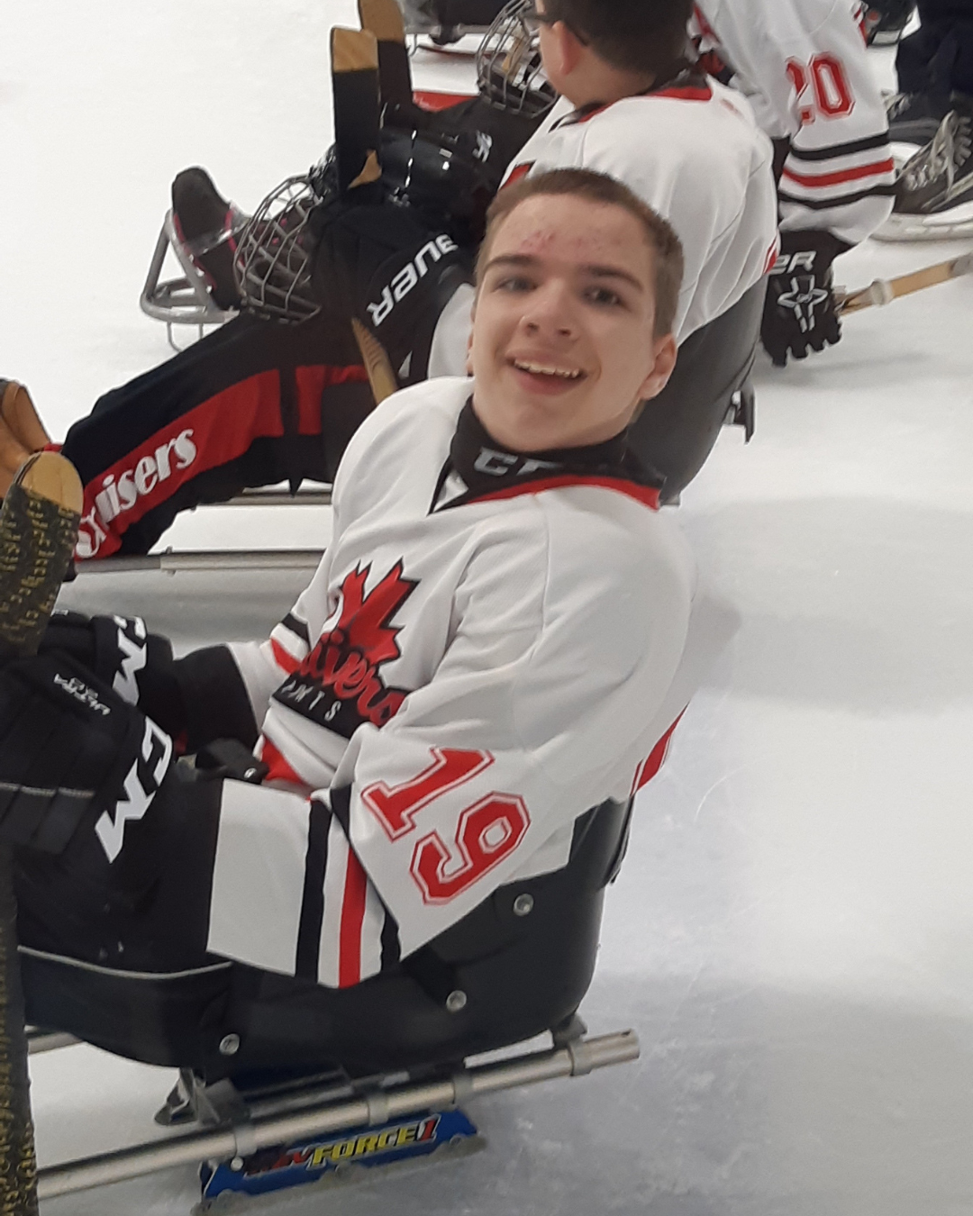Andrew playing sledge hockey through Cruisers Sports!