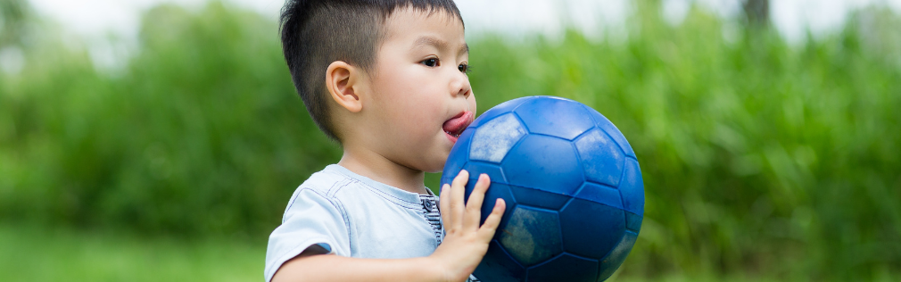 A child gets ready to throw a ball