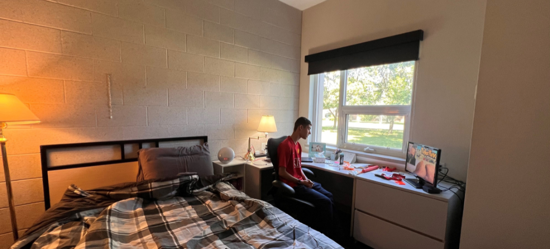 Jayden in his dorm room at Mohawk College