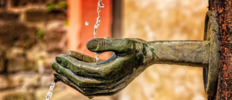 Statue hand with water pouring into it