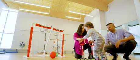 Family playing soccer