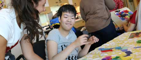 Young person sitting at a table