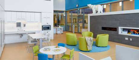 The Longo Family Resource Centre snapshot containing a kitchenette, lounging area, books, and children's craft tables