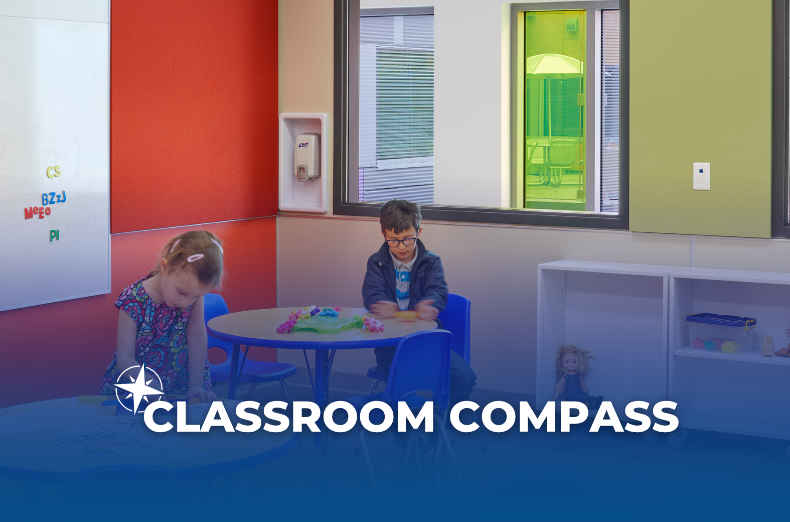 Two ErinoakKids clients are doing activities at a table in a classroom