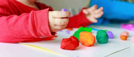 Child playing with Play-Doh