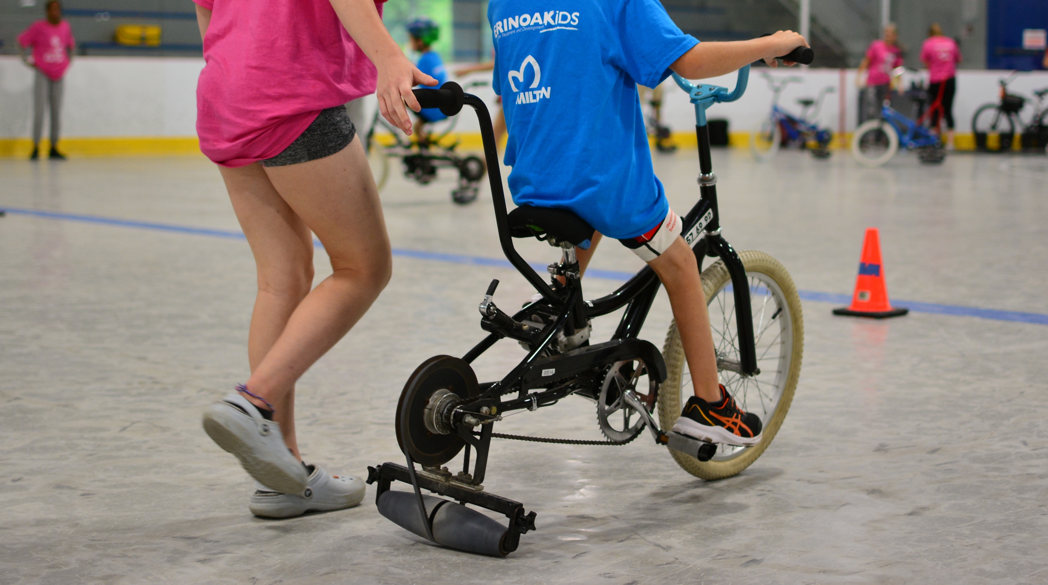 An adapted bike with a roller wheel at the back.