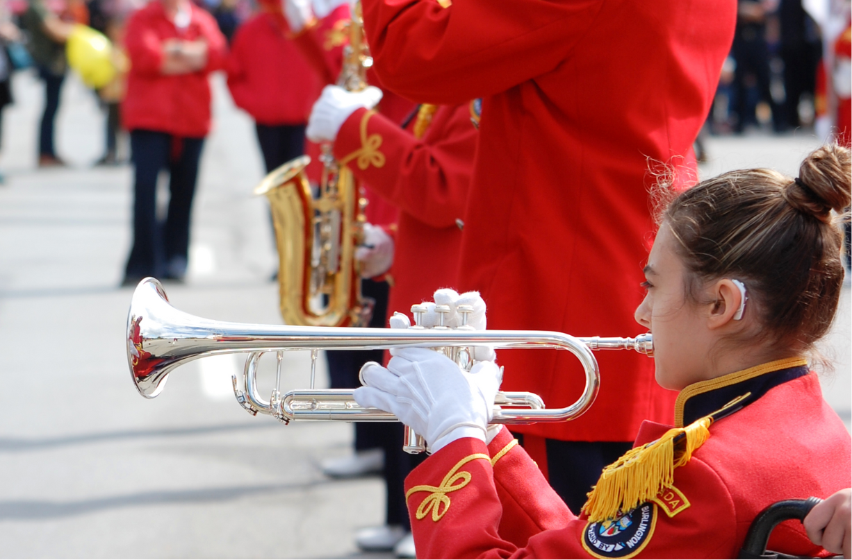 Lizzy playing the trumpet in the marching band