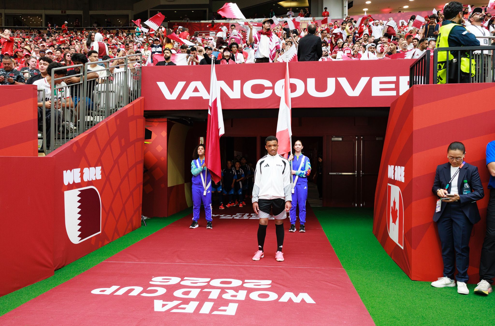 Jaisen stands at the team entrance of the stadium