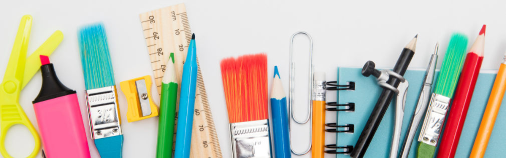 an array of school tools like scissors, markers, paintbrushes, rulers, and more